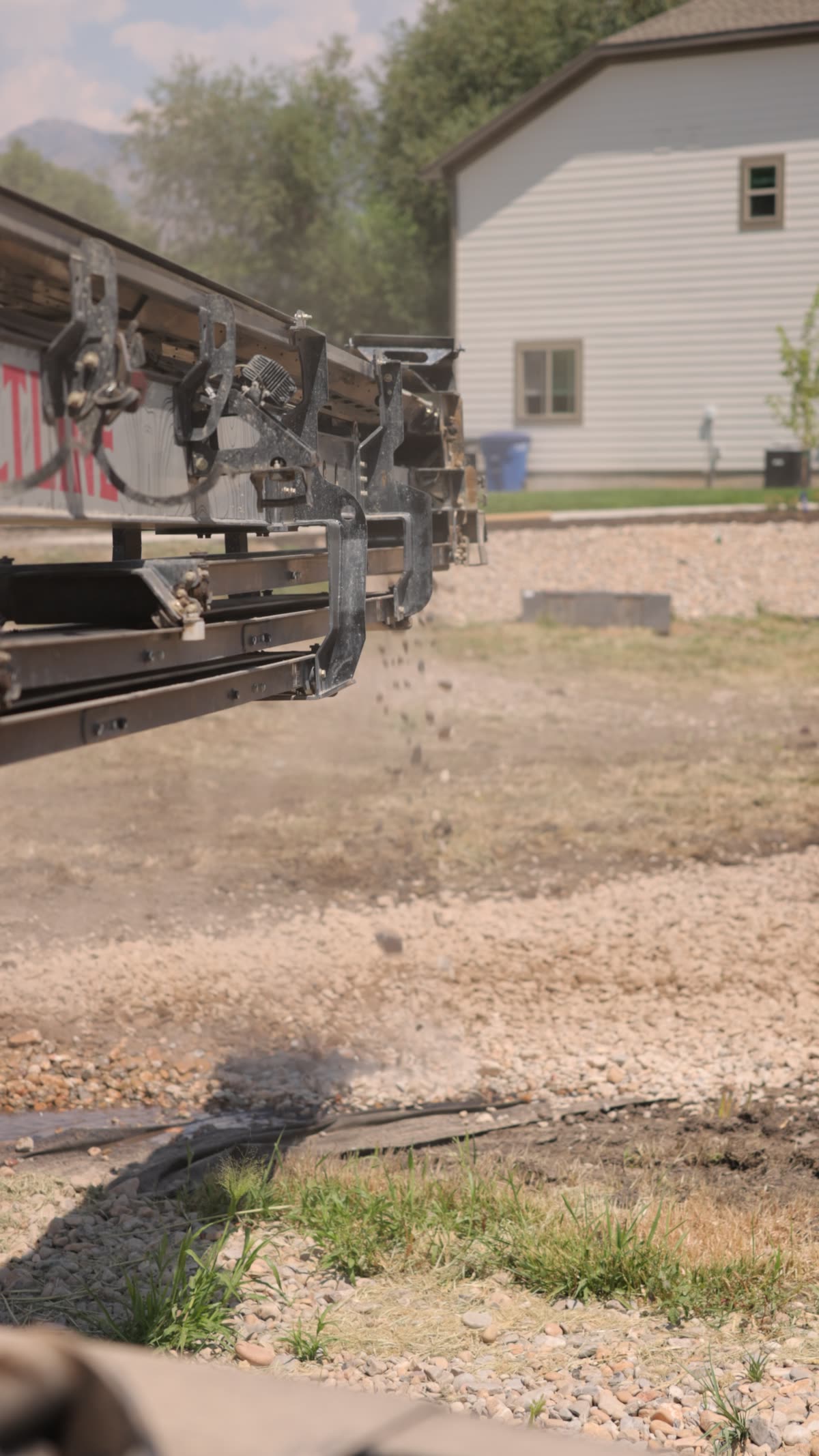 Gravel flying off the end of the telescoping belt