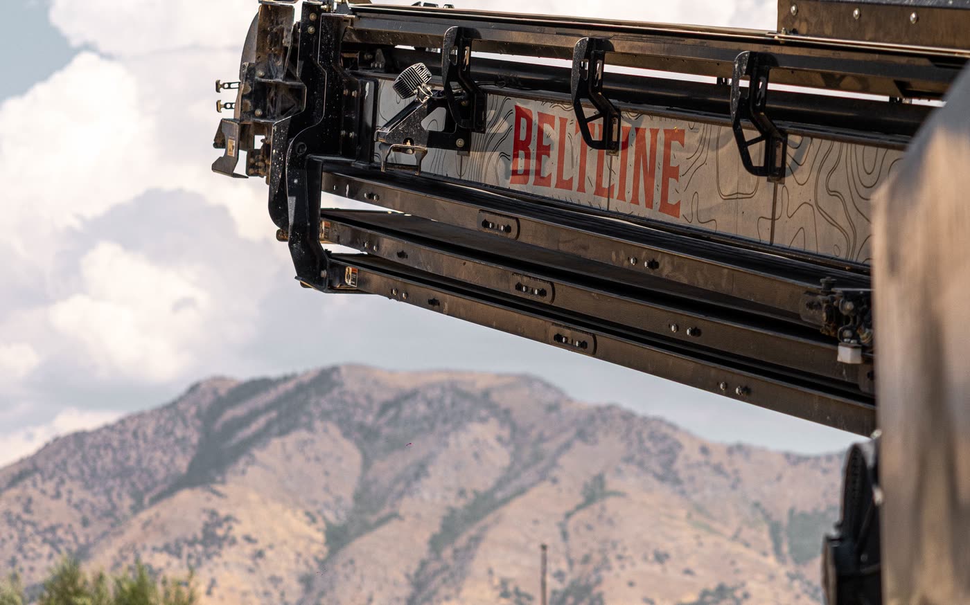 Conveyor boom extended with the Wasatch mountains behind