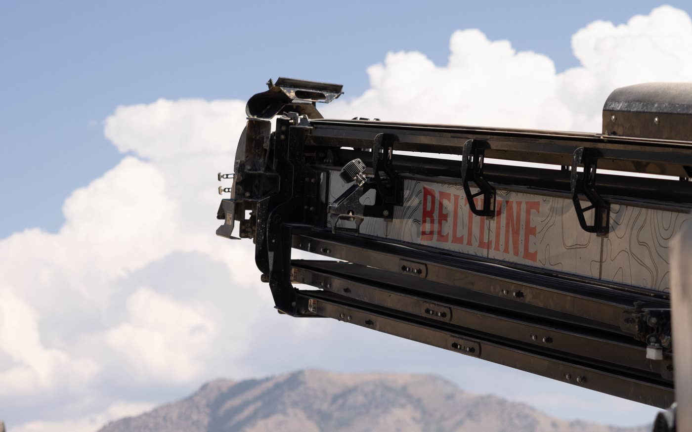The Beltline telescoping boom against a Northern Utah sky