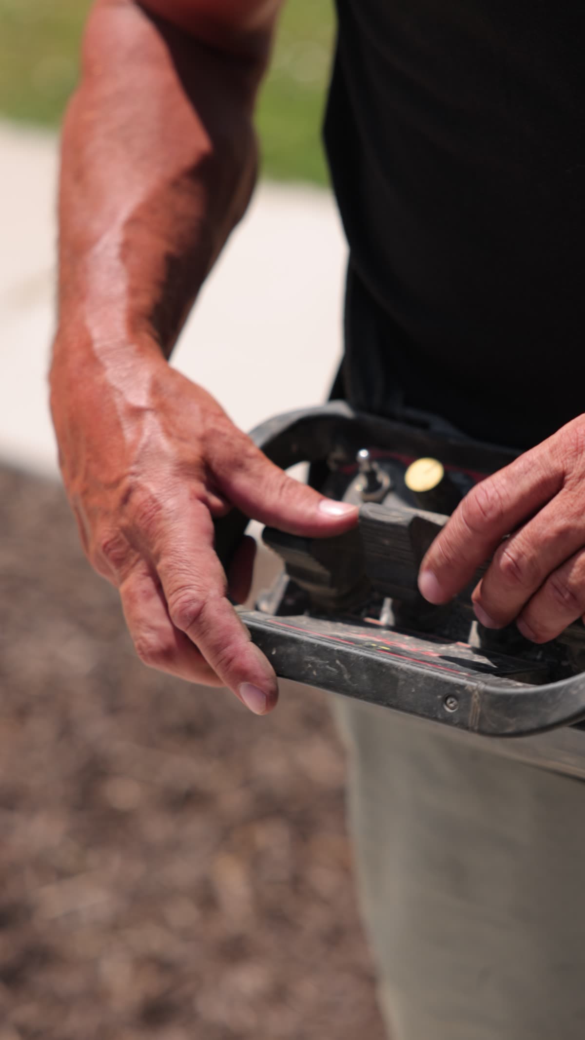 Operator hands on the wireless remote